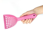 Pala Arenero Beco Rosado, hecha de materiales renovables como bambú y cáscara de arroz. Resistente, duradera y fácil de limpiar, ideal para el arenero de tu gato.